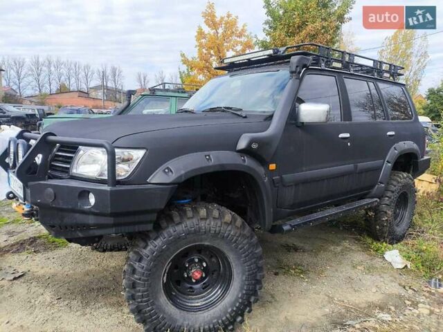Черный Ниссан Патрол, объемом двигателя 4.8 л и пробегом 396 тыс. км за 37000 $, фото 8 на Automoto.ua