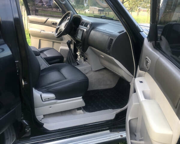 Черный Ниссан Патрол, объемом двигателя 3 л и пробегом 130 тыс. км за 19700 $, фото 5 на Automoto.ua