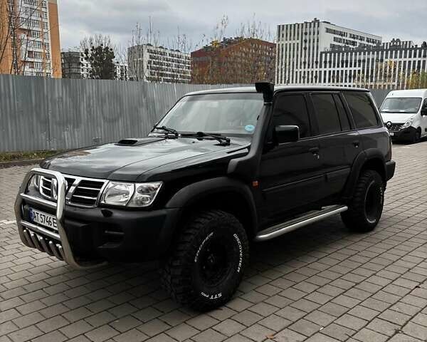Черный Ниссан Патрол, объемом двигателя 3 л и пробегом 276 тыс. км за 22500 $, фото 7 на Automoto.ua