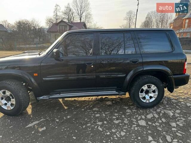 Черный Ниссан Патрол, объемом двигателя 3 л и пробегом 136 тыс. км за 18900 $, фото 6 на Automoto.ua