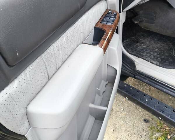 Черный Ниссан Патрол, объемом двигателя 4.8 л и пробегом 396 тыс. км за 37000 $, фото 2 на Automoto.ua