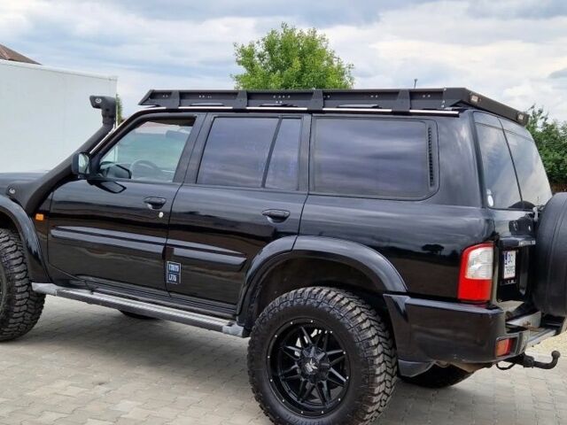 Черный Ниссан Патрол, объемом двигателя 3 л и пробегом 290 тыс. км за 3750 $, фото 2 на Automoto.ua