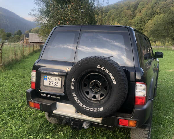 Черный Ниссан Патрол, объемом двигателя 3 л и пробегом 130 тыс. км за 19700 $, фото 3 на Automoto.ua