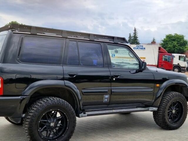 Черный Ниссан Патрол, объемом двигателя 3 л и пробегом 290 тыс. км за 3750 $, фото 6 на Automoto.ua