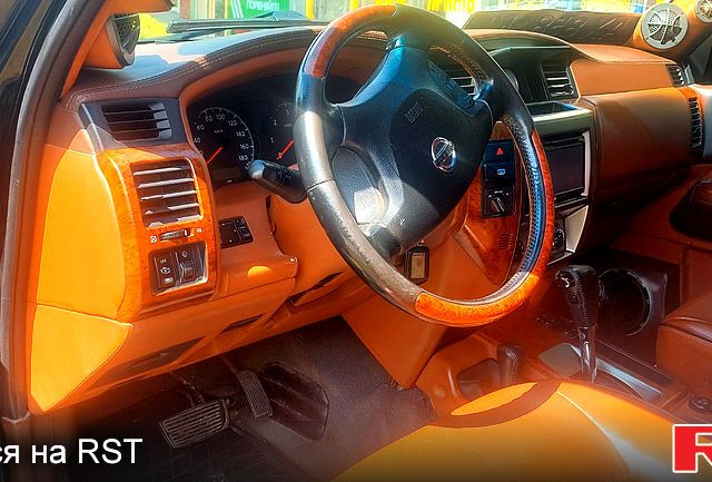 Чорний Ніссан Патрол, об'ємом двигуна 3 л та пробігом 232 тис. км за 12700 $, фото 4 на Automoto.ua