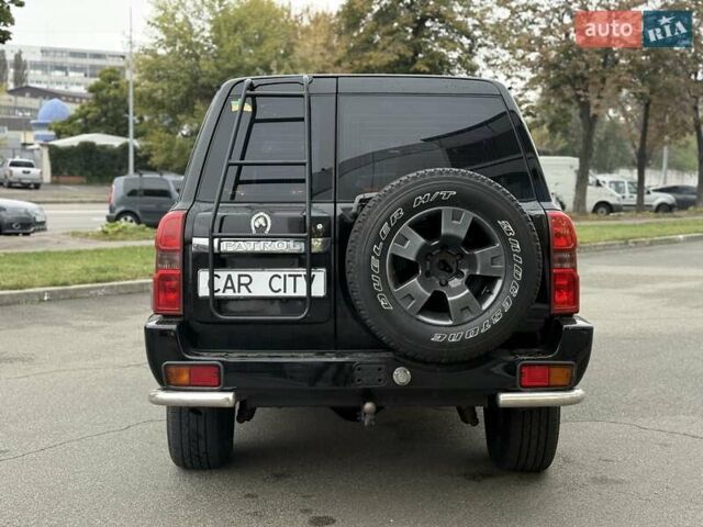 Черный Ниссан Патрол, объемом двигателя 3 л и пробегом 359 тыс. км за 18999 $, фото 5 на Automoto.ua