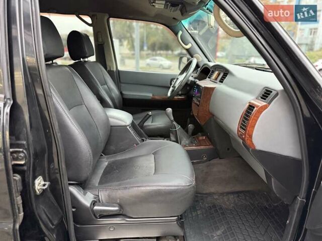 Черный Ниссан Патрол, объемом двигателя 3 л и пробегом 359 тыс. км за 18999 $, фото 10 на Automoto.ua