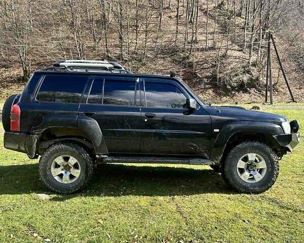 Черный Ниссан Патрол, объемом двигателя 3 л и пробегом 280 тыс. км за 22000 $, фото 5 на Automoto.ua