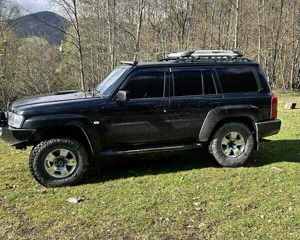 Черный Ниссан Патрол, объемом двигателя 3 л и пробегом 280 тыс. км за 22000 $, фото 3 на Automoto.ua