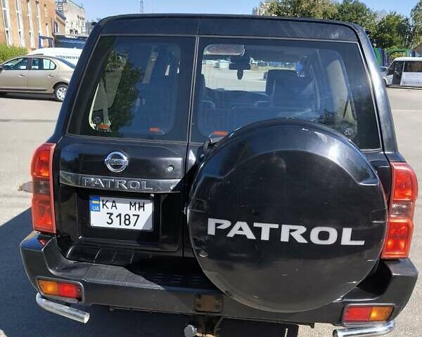 Черный Ниссан Патрол, объемом двигателя 3 л и пробегом 203 тыс. км за 21000 $, фото 5 на Automoto.ua