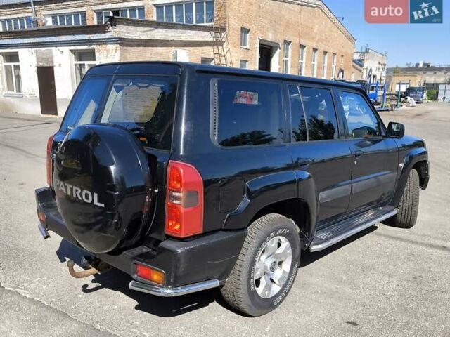 Черный Ниссан Патрол, объемом двигателя 3 л и пробегом 203 тыс. км за 21000 $, фото 4 на Automoto.ua