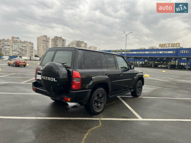 Черный Ниссан Патрол, объемом двигателя 3 л и пробегом 247 тыс. км за 21700 $, фото 7 на Automoto.ua