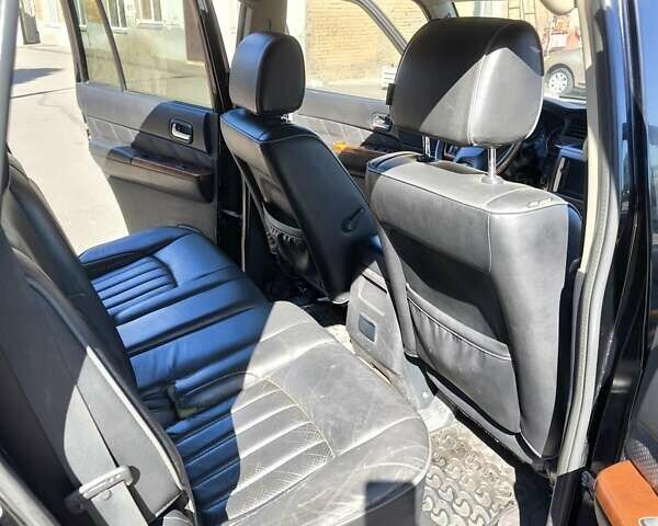 Черный Ниссан Патрол, объемом двигателя 3 л и пробегом 203 тыс. км за 21000 $, фото 11 на Automoto.ua