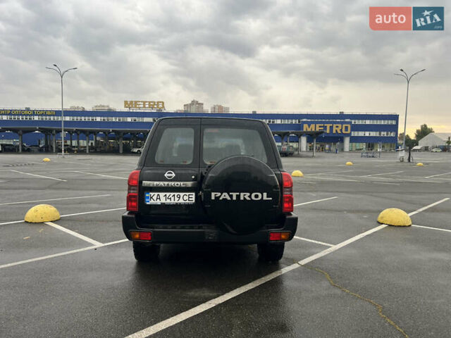 Черный Ниссан Патрол, объемом двигателя 3 л и пробегом 247 тыс. км за 21700 $, фото 6 на Automoto.ua