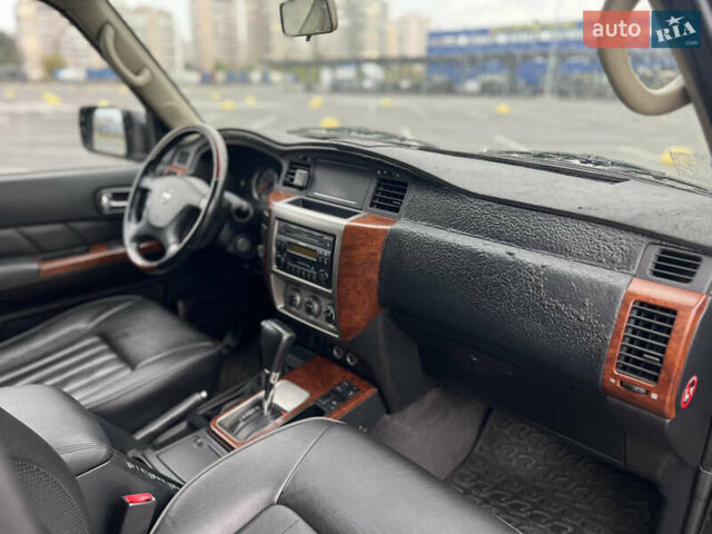 Черный Ниссан Патрол, объемом двигателя 3 л и пробегом 247 тыс. км за 21700 $, фото 31 на Automoto.ua