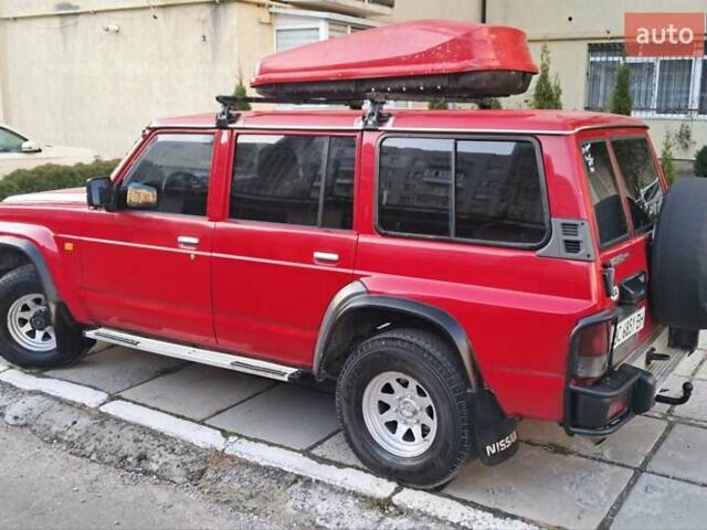 Красный Ниссан Патрол, объемом двигателя 2.8 л и пробегом 413 тыс. км за 12890 $, фото 3 на Automoto.ua