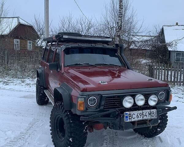 Червоний Ніссан Патрол, об'ємом двигуна 4.2 л та пробігом 300 тис. км за 14700 $, фото 11 на Automoto.ua