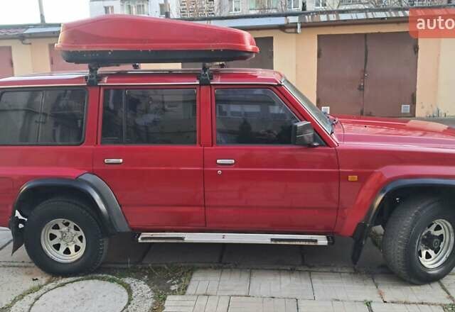 Красный Ниссан Патрол, объемом двигателя 2.8 л и пробегом 413 тыс. км за 12890 $, фото 9 на Automoto.ua