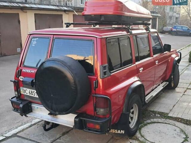 Красный Ниссан Патрол, объемом двигателя 2.8 л и пробегом 413 тыс. км за 12890 $, фото 6 на Automoto.ua