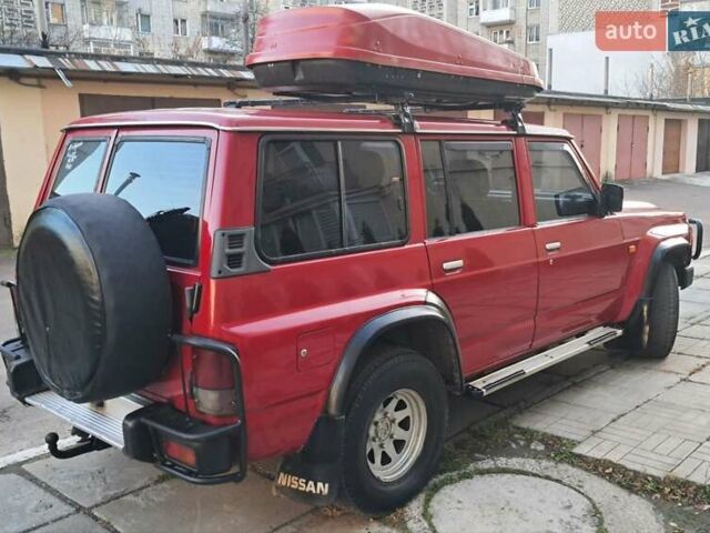 Красный Ниссан Патрол, объемом двигателя 2.8 л и пробегом 413 тыс. км за 12890 $, фото 7 на Automoto.ua