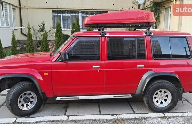Красный Ниссан Патрол, объемом двигателя 2.8 л и пробегом 413 тыс. км за 12890 $, фото 2 на Automoto.ua