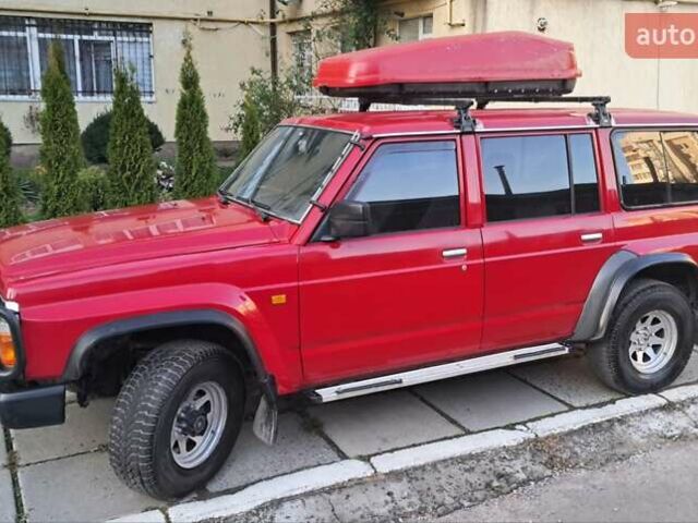 Красный Ниссан Патрол, объемом двигателя 2.8 л и пробегом 413 тыс. км за 12890 $, фото 1 на Automoto.ua