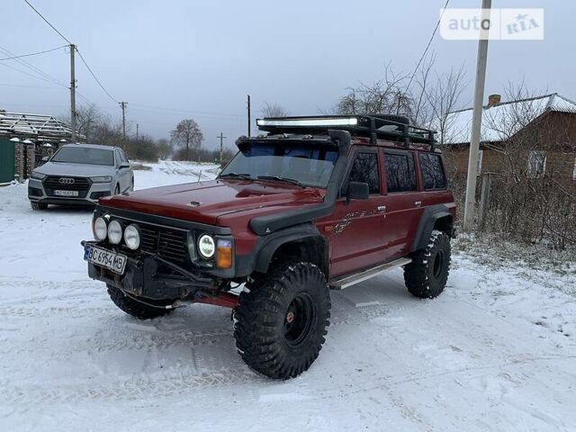 Червоний Ніссан Патрол, об'ємом двигуна 4.2 л та пробігом 300 тис. км за 14700 $, фото 1 на Automoto.ua