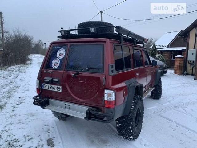 Червоний Ніссан Патрол, об'ємом двигуна 4.2 л та пробігом 300 тис. км за 14700 $, фото 6 на Automoto.ua