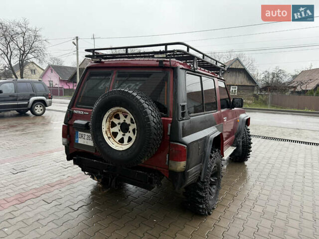 Красный Ниссан Патрол, объемом двигателя 2.8 л и пробегом 250 тыс. км за 7500 $, фото 4 на Automoto.ua