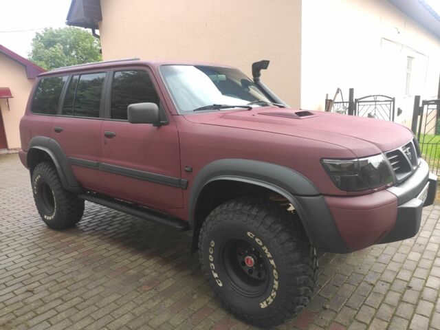 Красный Ниссан Патрол, объемом двигателя 3 л и пробегом 250 тыс. км за 35000 $, фото 3 на Automoto.ua