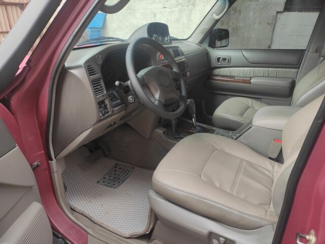 Красный Ниссан Патрол, объемом двигателя 3 л и пробегом 250 тыс. км за 35000 $, фото 7 на Automoto.ua