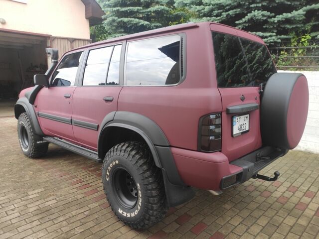 Красный Ниссан Патрол, объемом двигателя 3 л и пробегом 250 тыс. км за 35000 $, фото 6 на Automoto.ua