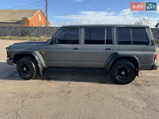 Сірий Ніссан Патрол, об'ємом двигуна 3 л та пробігом 296 тис. км за 12800 $, фото 4 на Automoto.ua