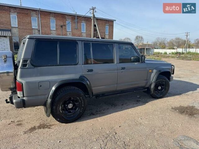 Сірий Ніссан Патрол, об'ємом двигуна 3 л та пробігом 296 тис. км за 12800 $, фото 2 на Automoto.ua