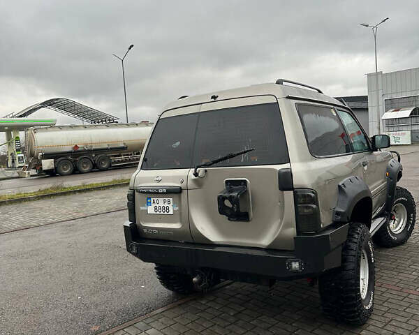 Серый Ниссан Патрол, объемом двигателя 2.95 л и пробегом 222 тыс. км за 25000 $, фото 2 на Automoto.ua