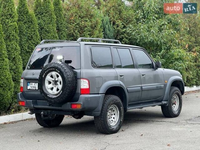 Серый Ниссан Патрол, объемом двигателя 3 л и пробегом 446 тыс. км за 15900 $, фото 2 на Automoto.ua