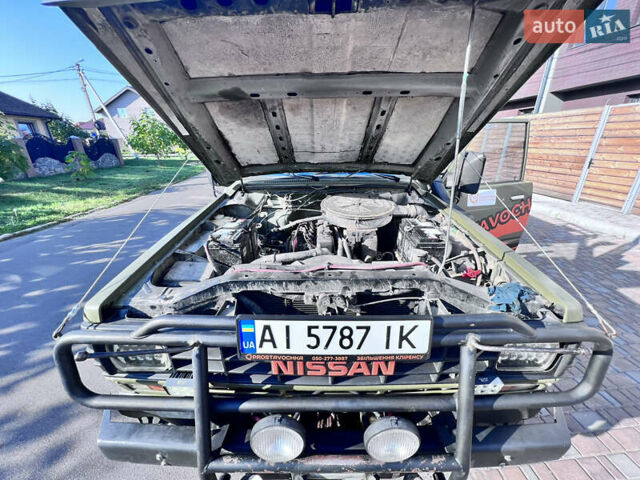 Зеленый Ниссан Патрол, объемом двигателя 3.2 л и пробегом 283 тыс. км за 12000 $, фото 6 на Automoto.ua