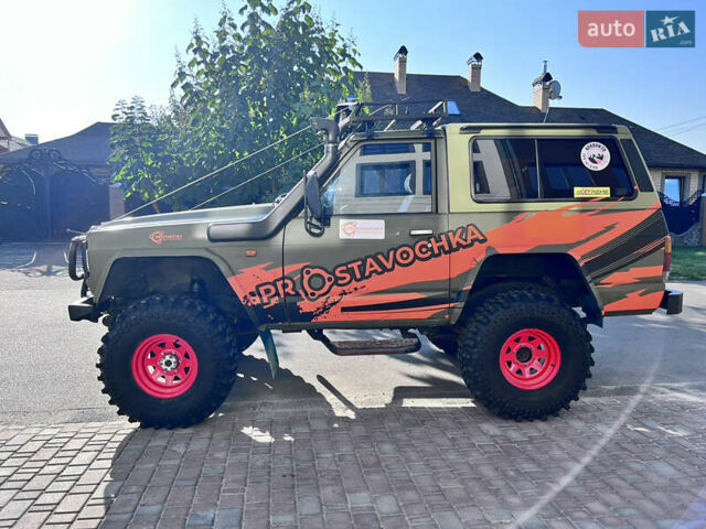 Зеленый Ниссан Патрол, объемом двигателя 3.2 л и пробегом 283 тыс. км за 12000 $, фото 3 на Automoto.ua