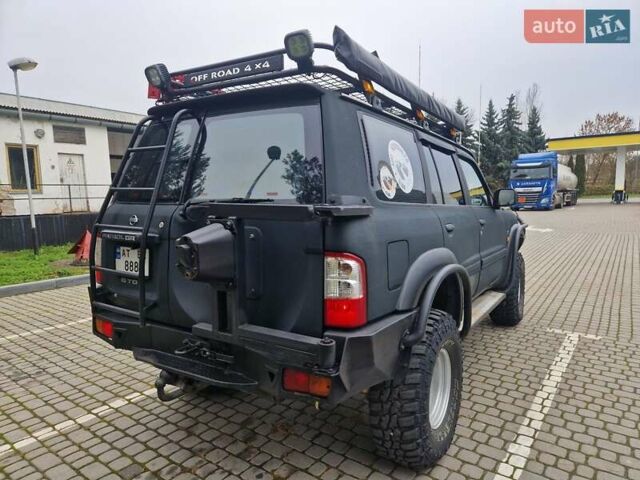 Зелений Ніссан Патрол, об'ємом двигуна 2.8 л та пробігом 198 тис. км за 19999 $, фото 12 на Automoto.ua