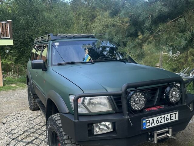 Зеленый Ниссан Патрол, объемом двигателя 4.2 л и пробегом 427 тыс. км за 35000 $, фото 7 на Automoto.ua