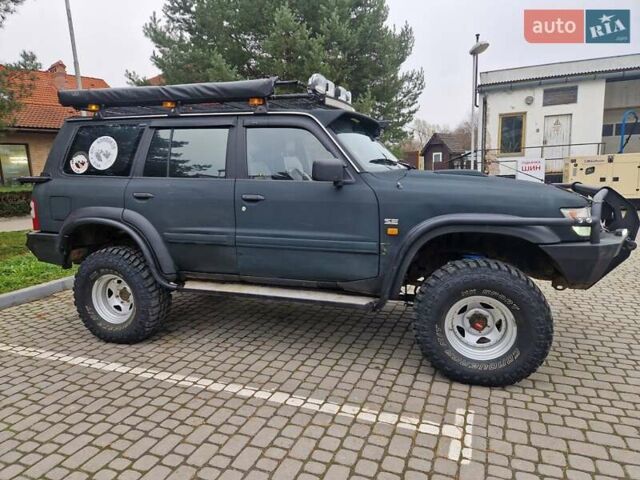 Зелений Ніссан Патрол, об'ємом двигуна 2.8 л та пробігом 198 тис. км за 19999 $, фото 16 на Automoto.ua