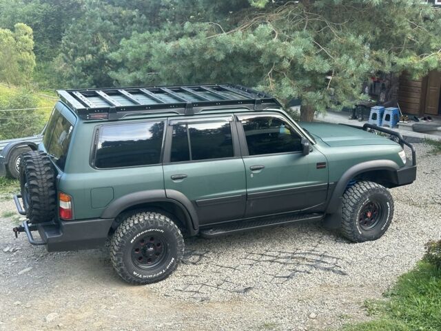 Зеленый Ниссан Патрол, объемом двигателя 4.2 л и пробегом 427 тыс. км за 35000 $, фото 2 на Automoto.ua