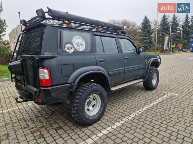 Зелений Ніссан Патрол, об'ємом двигуна 2.8 л та пробігом 198 тис. км за 19999 $, фото 14 на Automoto.ua