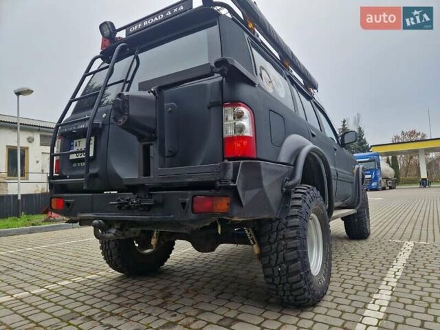 Зелений Ніссан Патрол, об'ємом двигуна 2.8 л та пробігом 198 тис. км за 19999 $, фото 13 на Automoto.ua