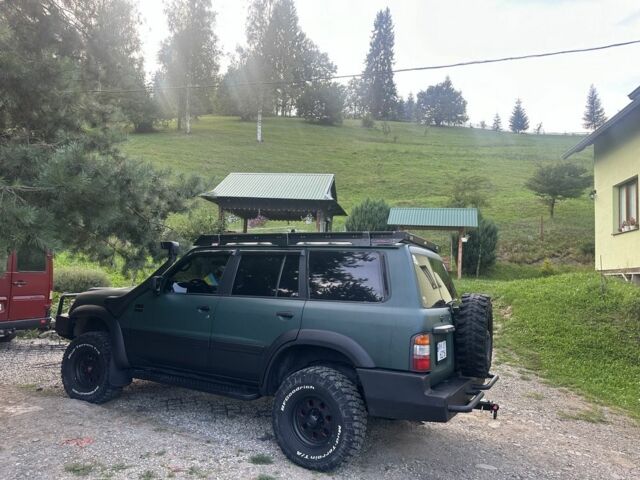 Зеленый Ниссан Патрол, объемом двигателя 4.2 л и пробегом 427 тыс. км за 35000 $, фото 4 на Automoto.ua