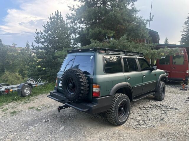 Зеленый Ниссан Патрол, объемом двигателя 4.2 л и пробегом 427 тыс. км за 35000 $, фото 6 на Automoto.ua