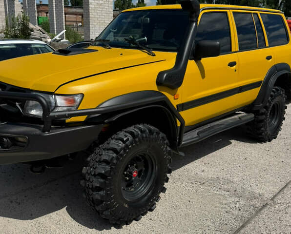 Зеленый Ниссан Патрол, объемом двигателя 4.2 л и пробегом 270 тыс. км за 26800 $, фото 4 на Automoto.ua