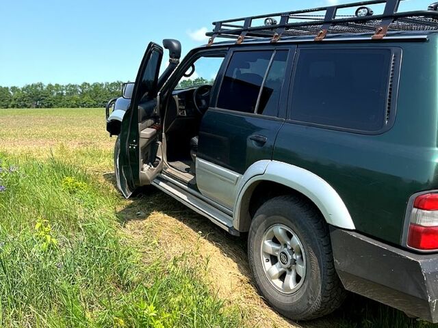 Зелений Ніссан Патрол, об'ємом двигуна 3 л та пробігом 275 тис. км за 11000 $, фото 6 на Automoto.ua