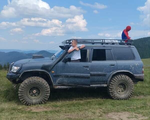 Зеленый Ниссан Патрол, объемом двигателя 2.83 л и пробегом 300 тыс. км за 23000 $, фото 3 на Automoto.ua