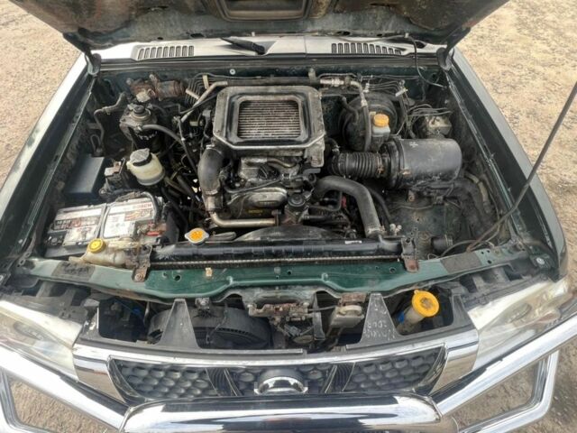 Зелений Ніссан Пікап, об'ємом двигуна 2.5 л та пробігом 300 тис. км за 6426 $, фото 10 на Automoto.ua